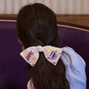 Lele Sadoughi Barrettes LA LAKERS LELE X NBA IVORY BOW BARRETTE